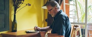 Man sitting at a desk at home