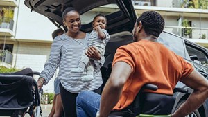 Family with one wheelchair user about to embark on a car journey