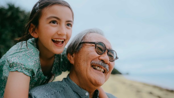 Grandparent and grandchild smiling