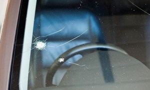 Chipped and cracked windshield on car