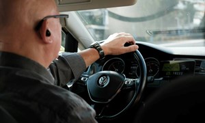 Older driver driving with a black box installed for insurance