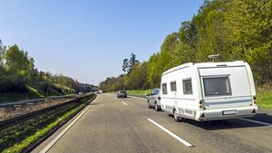 Caravan being towed along a main road