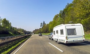 Caravan being towed along a main road