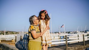 Grandmother and granddaughter cuddling