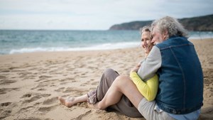 Couple cuddling on a beach