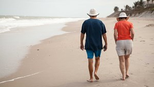 Couple walking along a beach