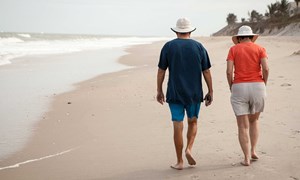 Couple walking along a beach